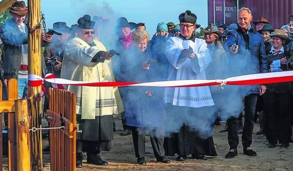 This meme is an image of a group of people, likely clergy, standing in a line and holding guns, with a banner in the foreground that reads "Gun Rite" in a playful, childlike font. The image is meant to be humorous, implying that the group is performing a mock "rite" or ceremony, but instead of a traditional religious service, they are firing guns. The image is likely meant to be ironic or satirical, poking fun at traditional religious rituals.